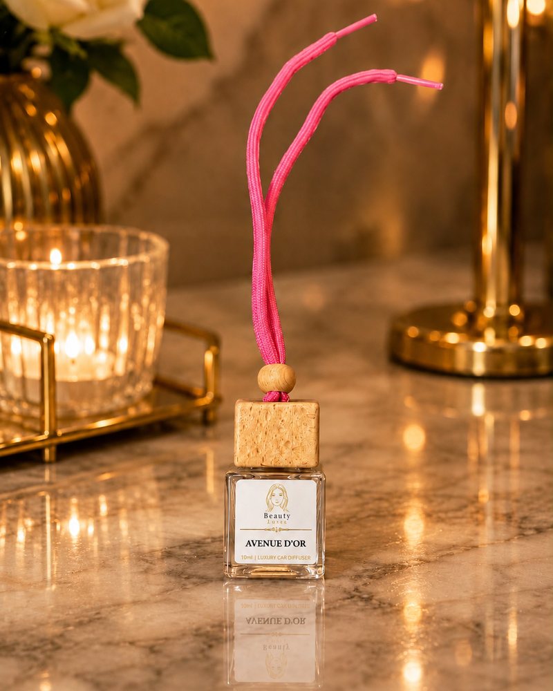 Beauty Luxe Avenue d'Or 10ml luxury car diffuser with a wooden cap and pink cord.