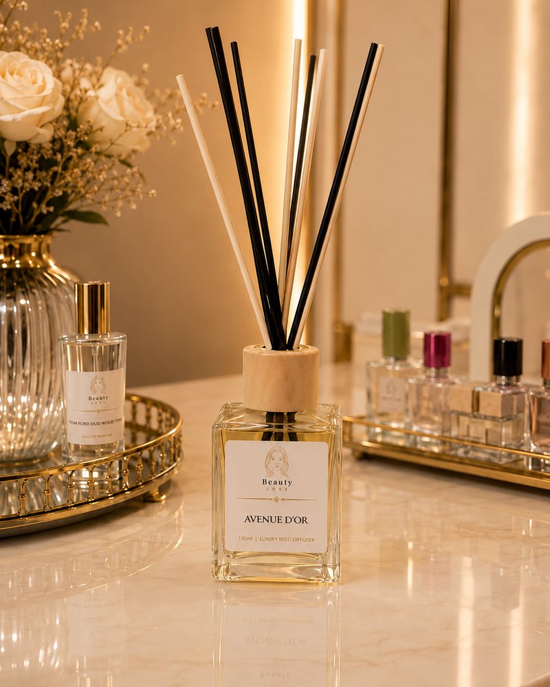 Beauty Luxe Avenue d'Or 150ml luxury reed diffuser in a clear glass bottle with a wooden collar.