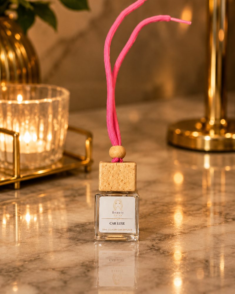 Beauty Luxe Car Luxe 10ml luxury car diffuser with a wooden cap and pink cord.