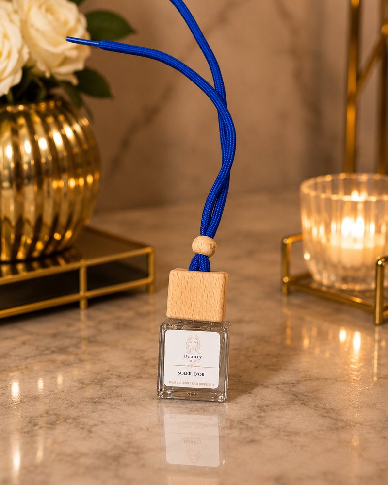 Beauty Luxe Soleil d'Or 10ml luxury car diffuser with a wooden cap and blue cord.